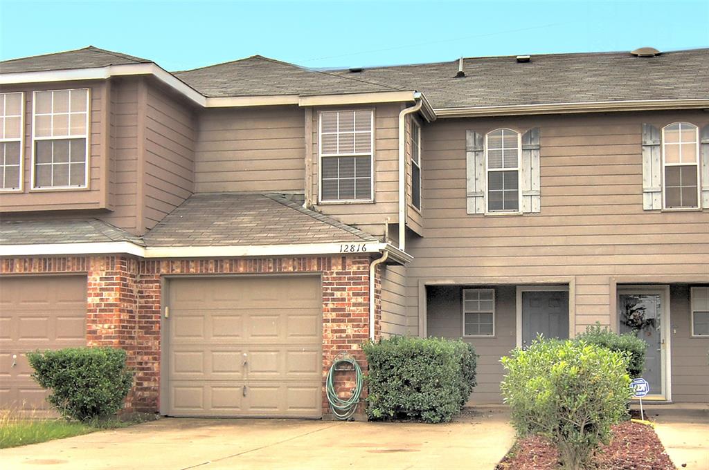 Cute, updated 2 story studio town home located in the 183 and 360 area close to DFW Airport and major highways.  Updated with laminate wood flooring throughout, ceramic tile in kitchen and baths, vaulted ceilings, updated ceiling fans, newish water heater, 2 inch blinds, fireplace, jacuzzi tub in master bath, lots of light in all rooms.  Kitchen has breakfast bar that opens to dining room.   Washer and dryer remain.  One car garage has storage cabinets.  Nice size backyard with fence.