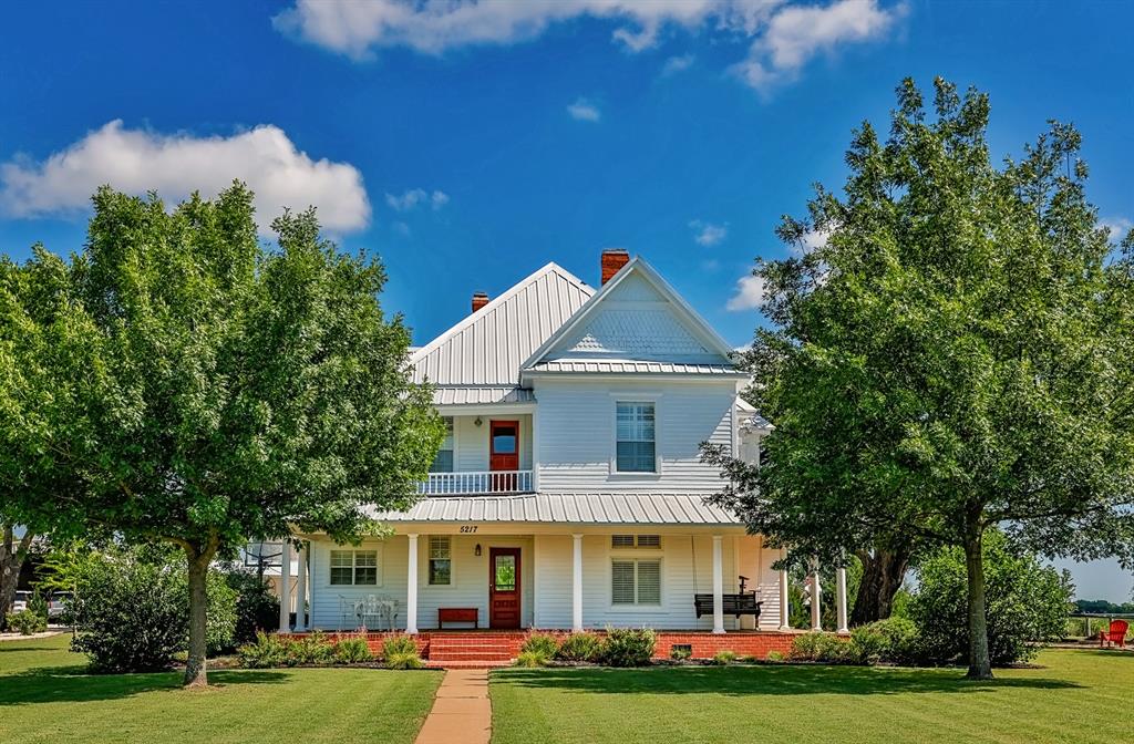 ARE YOU READY TO FALL IN LOVE? If so, here you go! Take a look at this truly one of a kind fully restored 1902 farmhouse blending timeless character and historic charm with modern luxury. Situated on scenic acreage with beautiful mature trees and expansive views, the owners have spared no expense on renovations and extensive landscaping, creating a property that is both stunning and thoughtfully designed. Enjoy a resort-style outdoor space with a custom swimming pool, spa, and covered kitchen and pavilion area perfect for entertaining. The spray foamed 30x30 shop equipped with electricity and heat and air offers versatility for storage, hobbies, workspace or gym. Come see for yourself the peaceful country setting with high end amenities throughout and easy access to and from I-35 for those who commute.