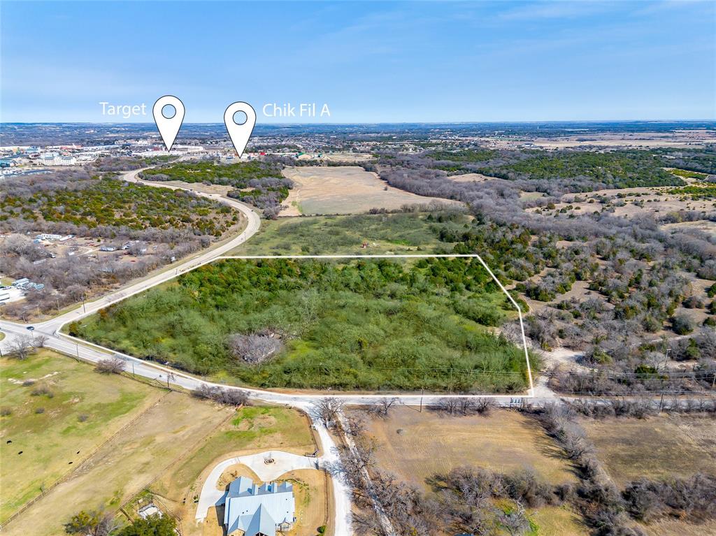 Amazing location less than .5 of a mile from I20 and Hwy. 51. This location is ideal for commercial development. It is just south of the future HEB and just west of Chick Filet and just north of the future residential development with Riverside Home Builders. There is apprx. 575 ft. of road frontage on BB FIELDER & 1000 ft. on Tin Top. Pre-development with the city of Weatherford supports commercial and or residential use.