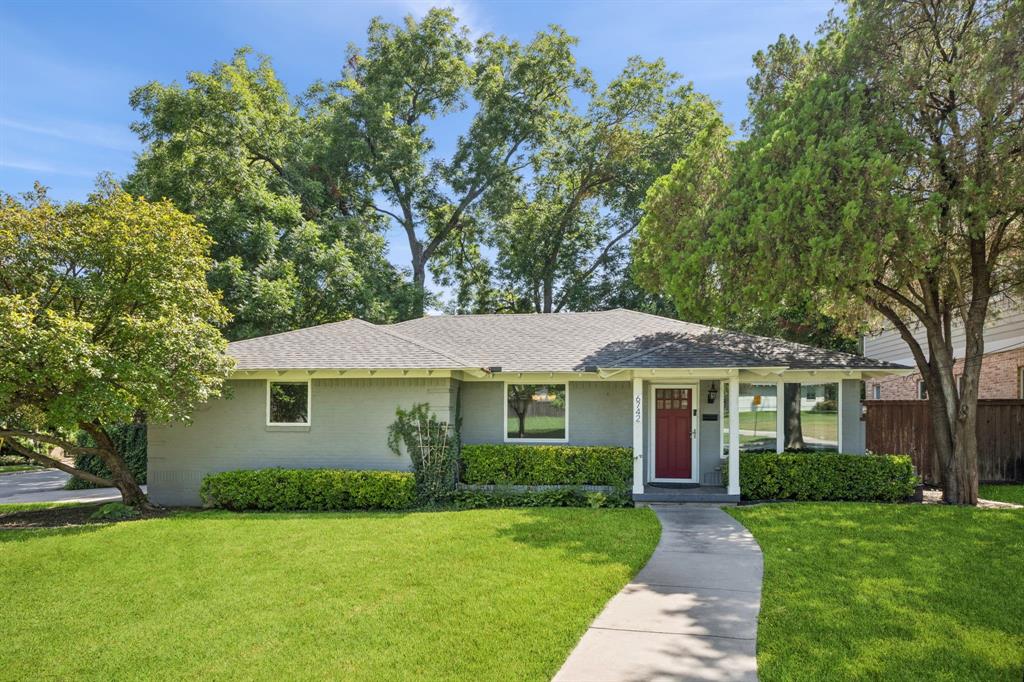 Situated on a waterfront, creek lot in the heart of Lakewood, home features updated KITCHEN, stainless appliances, granite counters, horizontal staggered tile backsplash, 4-burner gas cooktop, window above dual stainless sink, display cabinets w frosted glass, shelved pantry, wood floors, BREAKFAST w built-in banquette seating, storage drawers, custom shelving, decorative lighting, a FORMAL DINING with decorative chandelier, and wood floors adjacent to light-filled oversized LIVING at front of home with wood floors and multiple windows allowing abundance of natural light. PRIMARY ensuite at rear of home w decorative ceiling fan, wood floors, marble tile, floating vanity, dual sinks, walk-in tile surround shower w glass enclosure, and designer tile backsplash. Secondary BEDROOM w half BATH, walk-in closet and wood floors. Add'l BEDROOM suitable for office or flex room w space-saving pocket doors, shelved walk-in closet and wood floors. Full BATH in main hallway features tile bathtub, floating vanity, decorative lighting and full size Washer-Dryer area. Notable upgrades include windows replaced throughout, exterior doors w integrated adjustable mini-blinds, recessed lighting, recently painted interior, large backyard, sprinkler system, security system, side-entry garage, rear outdoor PATIO for entertaining, and wood dock at water's edge for launching boat, fishing or relaxing among towering trees in serene setting.  Located just minutes from SoPac Recreational Hike & Bike Trail, Lakewood Park, White Rock Lake, Dallas Arboretum & Botanical Gardens, area shopping centers, dining, and convenient to downtown Dallas.  A rare opportunity to invest in one of Lakewood's desirable neighborhoods!