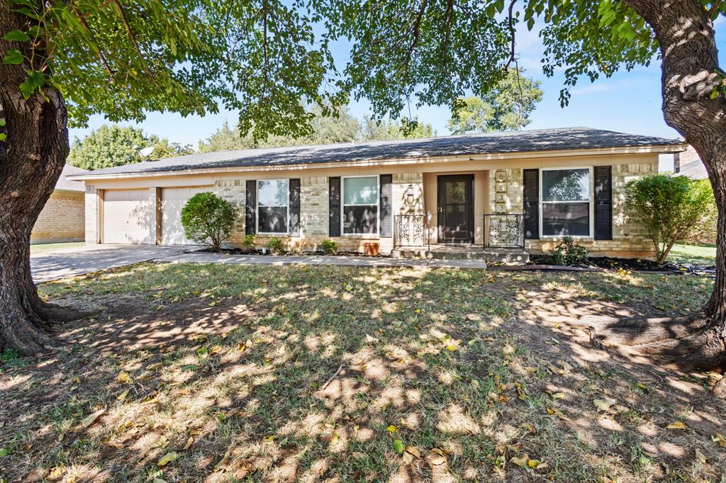 Beautifully maintained mid-century home in the heart of North Richland Hills! Located in the established Holiday Hills neighborhood, this spacious 3-bedroom, 2-bath residence offers over 2,000 sq ft of comfortable living with a thoughtful layout. The inviting living area features a wood-burning brick fireplace, ceramic tile flooring throughout (no carpet), and an abundance of natural light flowing in from the insulated solarium, perfect as a sunroom, home office, or play space. The kitchen includes granite countertops, double ovens, built-in cabinets, and a cozy breakfast nook. A split primary suite with an ensuite bath provides privacy, while two additional bedrooms and a second full bath complete the layout.

Recent updates include a 5-year-old HVAC system and 9-year-old roof in great condition. Enjoy the large backyard shaded by mature trees, ideal for entertaining or quiet relaxation. Conveniently located near schools, parks, and major commuting routes in Birdville ISD, this home blends timeless character with everyday functionality.