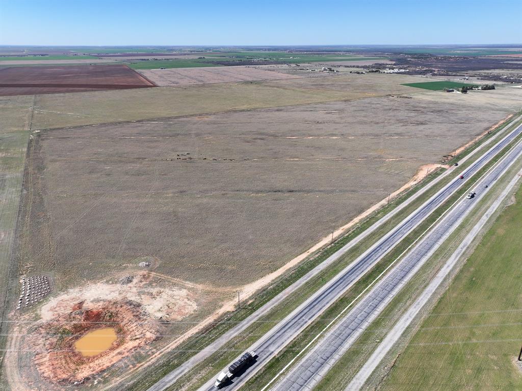 Excellent development opportunity just off Hwy 277, immediately south of Hawley in Jones County, a cleared tract currently used for cattle with an agricultural exemption and no deed restrictions. Hawley water line runs along the front of the property and electric service is available, making this an ideal site for subdivision, commercial development, or a substation. The land is level and clear, with easy access to Hwy 277 and strong utility infrastructure in place; bring your plans for residential lots, retail or industrial use, or utility projects. Additional details such as access and showing instructions available upon request. {Information believed accurate but not guaranteed. Property sold “as is.” Acreage, maps & fence lines are approximate. Buyers should verify details. Subject to errors, changes, prior sale, or withdrawal.}