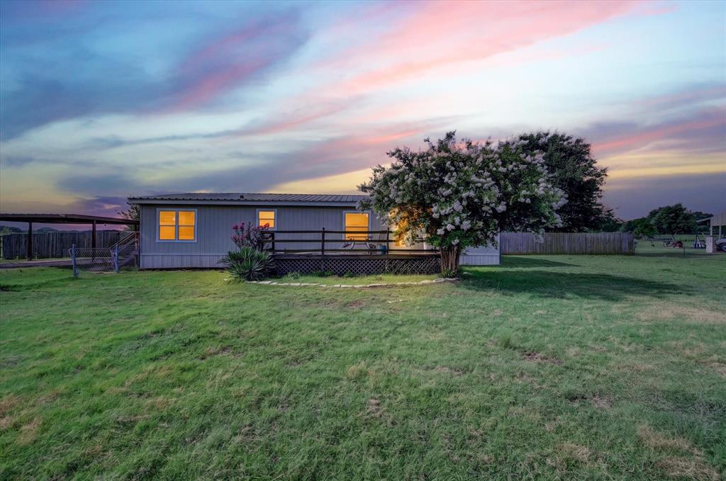 Great opportunity for investors or buyers looking to build equity! Situated on 1.85 acres, this 3-bedroom, 2-bath home features a spacious floor plan, barn, sheds, and fenced pasture. Bring your vision and unlock the potential of this country's property. Sold AS-IS, WHERE-IS