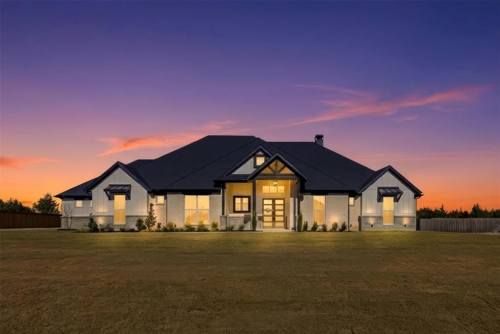 One-of-a-kind in Ellis County, this custom home by long-time builder Maxwell Custom Homes is nestled on a heavily treed, acre-plus lot in North Waxahachie. Located in a neighborhood known for quality builders and spacious one-acre homesites, this property offers the perfect blend of privacy, luxury, and convenience to town. Step inside to a stunning living room anchored by 12-foot ceilings with decorative beams and a gas fireplace, creating a warm and elevated gathering space. The heart of the home is the chef-inspired kitchen, featuring custom cabinets to the ceiling, a large island with decorative pendant lighting, and wet bar complete with wine fridge and mini fridge - ideal for entertaining. The thoughtful floor plan includes 4 bedrooms, 3.5 bathrooms, a dedicated study, and a game room, giving everyone space to spread out. The spa-like primary suite feels like a retreat, with a large walk-in shower with rain head, soaking tub, and a huge walk-in closet designed for serious storage. Secondary bedrooms are perfectly set up for guests or family with ensuite bathrooms. Outdoor living takes center stage with an expansive covered patio, a second gas fireplace, and stub outs for an optional outdoor kitchen - the perfect spot to unwind, host friends, or simply enjoy the wooded backdrop and peaceful setting. 250 gallon buried propane tank is also included. If you’ve been looking for a luxury custom home on an acre-plus lot with trees, privacy, and a highly functional floor plan, this one checks every box. Schedule your showing today!