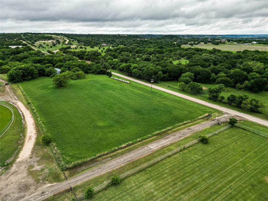 Beautiful 4.92-acre tract featuring a combination of open pasture and mature hardwood trees. The front portion of the property is currently planted in oats, while the back portion offers a heavily treed area with mature hardwoods providing shade and privacy.

Improvements include a Quonset hut and an animal barn with a hay loft. The property offers open space suitable for livestock, agricultural use, storage, or a future homesite. Small acreage tracts in Bosque County are becoming increasingly difficult to find, making this property a great opportunity for buyers looking for usable land with a mix of open pasture and wooded acreage.