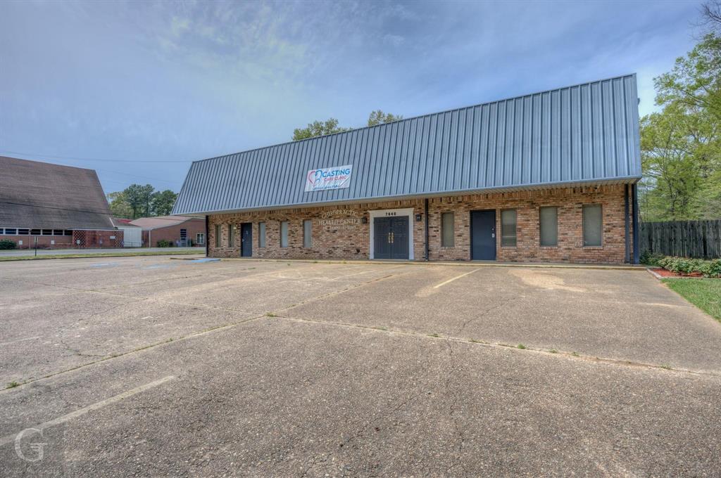 Corner lot on 1.478 total acres. Prime location with tall business sign at corner. Easy access to Hwy 3132 & Mansfield Rd. Large paved parking lot with approximately 20-25 spaces. Versatile commercial building ideal for a variety of businesses. Currently used as a medical office. Listing includes 2 lots in back of building on Millard St side for future growth potential. Flexible floor plan. 3 recently renovated bathrooms, lobby, 5 office spaces, 7 exam rooms, kitchen area, laundry room, x-ray room & upstairs storage area. New dual-zone AC units (2024). Building layout with several entrances at front & side could be subdivided for multiple tenant use conversion - making it an ideal investment opportunity. Building appraisal on file for $267,000. This property is not in a flood zone. Building & lot next to it are zoned C-2 (Corridor Commercial Zoning District). The other lot is zoned R-17 (Single Family Residential) - can potentially be rezoned as commercial through the MPC depending on intended use. Owner financing available.