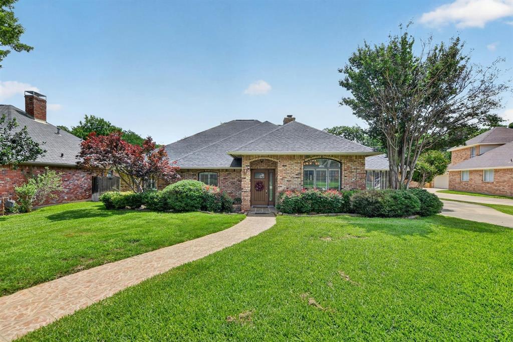 Escape to your own secluded sanctuary in this beautifully established River Bend neighborhood, tucked away on a quiet street just a brief stroll from the green spaces of Clarence Thompson Park. The tree-lined backyard transforms into a vacation-level paradise featuring a sparkling pool and spa plus a large covered patio with a ceiling fan. Designed for both lively entertaining and quiet relaxation, the single-story layout flows beautifully from one inviting space to the next. Rich architectural details like elegant plantation shutters and vaulted ceilings with decorative beams set a sophisticated tone, while an impressive floor-to-ceiling brick fireplace anchors the home with warmth. Mix drinks at the wet bar in the expansive family room, or head into the pristine kitchen equipped with granite countertops, decorative backsplash, and a breakfast area with bay windows. The sprawling primary suite feels like a luxury hotel, showcasing an intricate double tray ceiling, dual walk-in closets, split vanities, a deep soaking tub, and a separate shower. Positioned on the opposite side of the home from the primary suite, a separate secondary bedroom sits next to its own full bathroom, offering an ideal independent setup for long-term guests, multi-generational living, or a quiet home office. With big-ticket items like the AC unit and pool equipment recently replaced, you can simply move in and enjoy summer. And, to make your move completely seamless, the refrigerator, washer, and dryer are all included with the sale of the home. Boasting easy access to I-30 and 360 for an effortless daily commute, this rare gem combines absolute tranquility with ultimate convenience. Take a first-person look at this gorgeous home! Click the Virtual Tour link to see the 3D Tour!