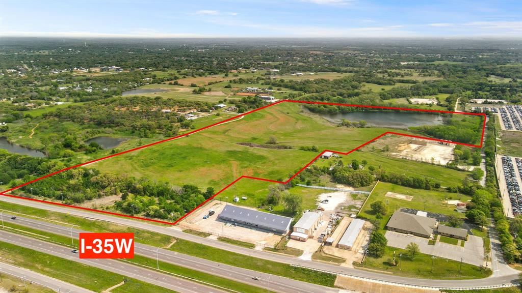 Great opportunity to own land with road frontage on I-35W within Burleson city limits. Located just 25 minutes from downtown Ft. Worth! This property is not currently zoned commercial, it will be up to the buyer to convert to commercial. Over 745 ft of road frontage on I-35W, which has over 165,000 vehicles passing per day. Currently zoned Ag. Potential to purchase up to 98 acres altogether. See pictures for the additional land available, three separate listings. Bethesda Water Supply is water provider for this area.