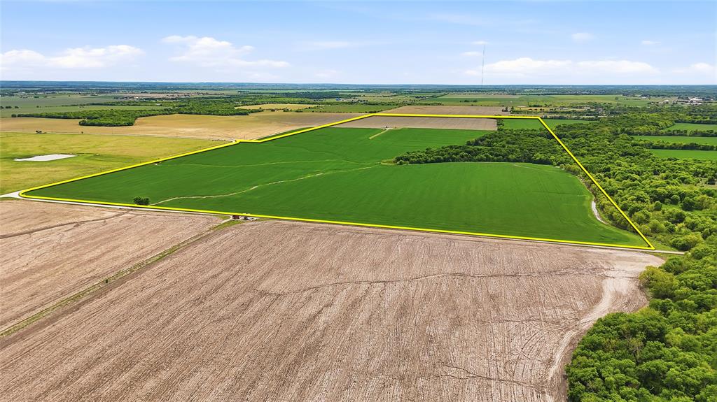 Positioned in the direct path of growth in Grayson County, this ±200-acre tract offers a rare opportunity for investors, developers, or 1031 exchange buyers looking to secure a strategic long-term hold. Currently ag exempt and leased for agricultural production ensures the property is well maintained for ag use while keeping holding costs low. Ideally located just south of Hwy 82 and east of Hwy 377, and west of Hwy 289, this property sits only a few miles from the proposed Dallas North Tollway expansion—one of the most anticipated infrastructure projects set to reshape the Texoma region. With approximately 3200’ of road frontage on both Macomb Cemetery Road and Davis Rd, access and future development flexibility are already in place. Utilities are within reach with Two Way Water SUD servicing the area, including a 6” water line just north of Shook Rd (buyers to verify capacity and availability for intended use). The land is unzoned with no known restrictions , opening the door for a wide range of future possibilities—from continued agricultural use to potential residential, commercial, or mixed-use development. Grayson County continues to see explosive growth driven by major employers like Texas Instruments and GlobalWafers, along with continued expansion from the DFW Metroplex. This location offers the perfect balance of rural privacy with proximity to Sherman, Denison, and the broader DFW area for dining, entertainment, and business. Recreational opportunities are also nearby, with Lake Texoma and Lake Ray Roberts both within easy reach—adding even more long-term appeal for future development or resale. Whether you're looking to land bank, develop, or secure a legacy asset in a high-growth corridor, this property checks all the boxes.
