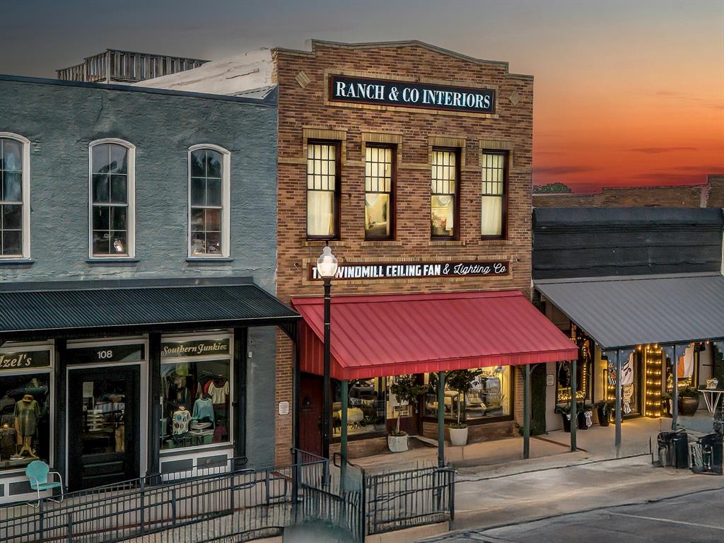 PRICE IMPROVEMENT – ICONIC INCOME-PRODUCING PROPERTY ON THE SQUARE
Historic 1892 Mixed-Use Building  Now Offered at $849,000
Positioned directly on the square in the heart of historic downtown Pilot Point, this fully restored 1892 landmark presents a rare opportunity to own a cash-flowing, mixed-use asset in one of North Texas’ fastest-growing corridors near Lake Ray Roberts.

With approximately 4,300 sq ft, this property is purpose-built for investors and owner-operators seeking immediate income with long-term upside.
Income & Investment Highlights
Established commercial tenant occupying ~2,000 sq ft (steady income stream)
2,300 sq ft residential loft currently operating as a short-term rental
Turnkey setup with proven income potential from day one
Flexible mixed-use zoning allows for retail, office, hospitality, or expanded STR use
Historic Character That Commands Premium Rents
Original exposed brick walls, wood beams, and tin ceilings
Thoughtfully restored to preserve authenticity while supporting modern use
Includes curated furnishings and antiques, plus a rare vintage safe—enhancing both experience and value

Prominent on-the-square presence with strong foot traffic and visibility
Walkable to local dining, shopping, and year-round community events
Rooftop deck with views toward Lake Ray Roberts—a standout feature for guests and tenants alike
Why This Property Stands Out
Properties with this combination of historic charm, income generation, and prime square location rarely become available in Pilot Point. With continued growth expanding north from the DFW metro area, this asset is well-positioned for both immediate returns and future appreciation.
Opportunities like this don’t sit forever—especially at this new price point.
Schedule a private showing and secure one of downtown Pilot Point’s most distinctive and versatile investment properties.