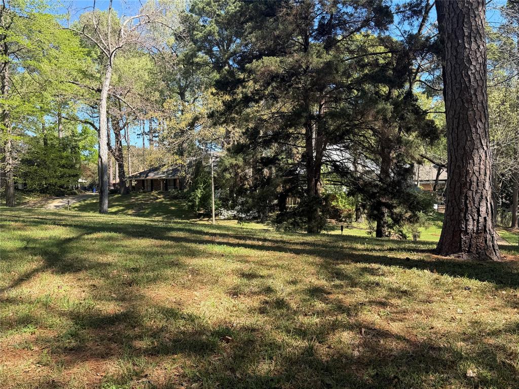 This is a unique opportunity to own a beautiful piece of property in Spring Lake. Great location within the neighborhood. Right under an acre. Sits nice and high, with water views across the street. Mature trees. Sidewalks. Plans available. Plat attached.