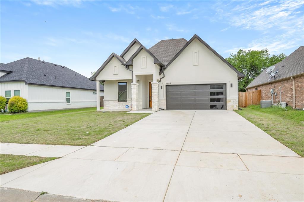 Clean and move-in ready, this 4-bedroom, 2-bath home is centrally located in the desirable Deer Meadow Subdivision. Featuring an open floor plan and split-bedroom arrangement, this home offers both comfort and functionality for everyday living. The kitchen is designed for gathering, with a large island and breakfast bar that flows seamlessly into the living and dining areas. The spacious living room showcases tall ceilings and a cozy electric fireplace, while the dining and living areas overlook the backyard, bringing in natural light and a welcoming feel. The primary ensuite provides a private retreat, and the home also includes a nice-sized laundry area and a 2-car garage for added convenience. Step outside to enjoy the covered back porch and fenced backyard, perfect for relaxing, entertaining, or pets. This well-maintained home offers style, space, and a convenient location—ready for you to move right in!