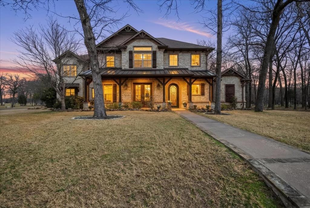 An absolutely stunning Tuscan inspired corner lot home located in the coveted Pinnacle Club golf course community on Cedar Creek Lake in Mabank. Pinnacle Club is a wonderful community that has a guarded & gate entrance, clubhouse with restaurant & bar, golf course, pool, fitness center, party pavilion, tennis & pickleball courts. This gorgeous custom home features a 3 car side Garage and additional space for a golf cart, 4 Bedrooms, 3 Baths, 2 Living spaces, formal Dining Room, Breakfast Nook, dedicated Office space & Movie Theater. From the gorgeous ornate crown molding, beautiful stone detailing, decorative cabinetry & built ins, this property offers luxury at a great location. The living room features a stone fireplace & striking wood ceiling beams. Follow the beautiful, unique real wood flooring through the Living Room and take advantage of the prestigious Kitchen equipped with both a breakfast bar & island. Enjoy hosting meals in either the formal Dining Room or Breakfast Nook that has a beautiful bay window overlooking the backyard. The Primary Suite is located on the ground floor & has an ornate chandelier, vaulted ceilings and large windows offering natural light & views of the outdoors. The stunning en suite Bathroom features a soaking tub underneath an ornate chandelier & the built in cabinetry offers plenty of additional storage options. A second Bedroom is on the ground floor & the upstairs features two additional Guest Bedrooms, one full Bath, an Office & bright & airy Flex Space. It is also home to your own personal Movie Theater complete with a Bar area. The Utility Room downstairs has its own sink, upper and lower cabinets & another built in Office area. This home has a state of the art surround system.  Enjoy quiet evenings underneath the covered patio complete with an outdoor living center & gas fireplace. If you’re looking for gorgeous features, beautiful woodwork & a wonderful community that offers plenty of activities, this home is a must see!