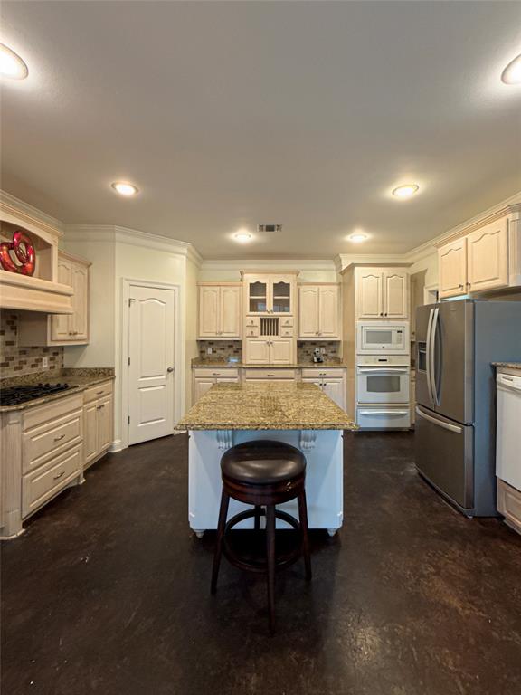 Amazing opportunity in Forest Hills! This spacious 4-bedroom, 2.5-bath home offers over 3,000 square feet of living space with soaring ceilings, abundant natural light, and a functional open-concept layout. The oversized kitchen features granite countertops, custom cabinetry, a large center island, gas cooktop, double ovens, and ample storage, making it ideal for both everyday living and entertaining. 

The living room showcases dramatic floor-to-ceiling windows overlooking the backyard and a beautiful gas fireplace. Downstairs is the master bedroom, along with an office space that could be used as a 5th bedroom, while upstairs offers additional bedrooms and flexible living space. 

Outside, you’ll find a large fenced backyard, extended patio, and plenty of room for outdoor enjoyment. With nearly half an acre, this home is perfect for gathering. Located in the desirable Forest Hills subdivision with convenient access to Haughton amenities and highly rated schools.