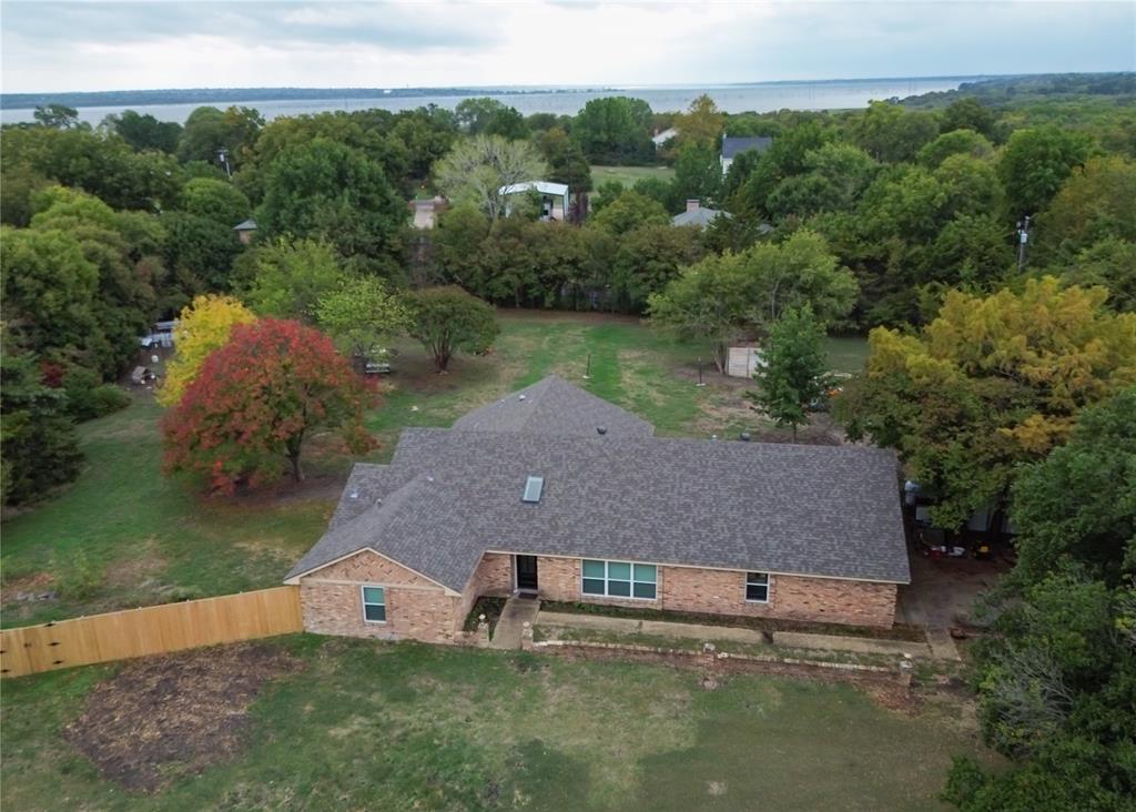 Beautifully remodeled home on a secluded 1.34 acre lot. Recent renovations include cabinets, counter tops, flooring, windows, appliances and so much more. Ask for a complete list. The kitchen is sure to impress. It features a 7-burner double oven range and a large island with plenty of space for cooking and entertaining. The big private back yard has lots of trees and a chicken coop. Outstanding Wylie schools, no city property tax, no HOA, close to Lake Ray Hubbard.