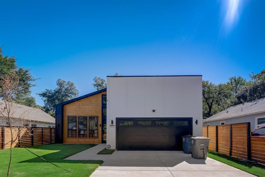Built new in 2023 and cared for by a single owner, this single-story contemporary near downtown Dallas lives like new construction, without the wait (2,050 sq ft, per Builder). Inside, an open-concept layout connects the living, dining, and kitchen beneath natural light, anchored by a granite island kitchen with stainless steel appliances, generous cabinetry, a pantry, and room to gather and prep. The living room centers on a fireplace, with a separate dining space alongside. Waterproof engineered wood floors run throughout. No carpet anywhere, for an easy care, cohesive feel. The spacious primary suite is a private retreat with a large walk-in closet and a spa-style en-suite featuring a walk-in shower with dual shower heads and granite counters. The thoughtful four-bedroom layout means no one walks through a bedroom to reach a bath: two secondary bedrooms connect through a Jack-and-Jill bath with a tub and dual sinks, while the fourth bedroom enjoys its own en-suite with a walk-in shower and a separate hall entrance. Ideal as a guest bath. A dedicated laundry room, and attached two-car garage complete the home, and the spacious backyard leaves room to garden, dine outdoors, or simply unwind. Move-in ready and offered at $425,000 — explore the floor plan and 3D tour online, then schedule your private showing.