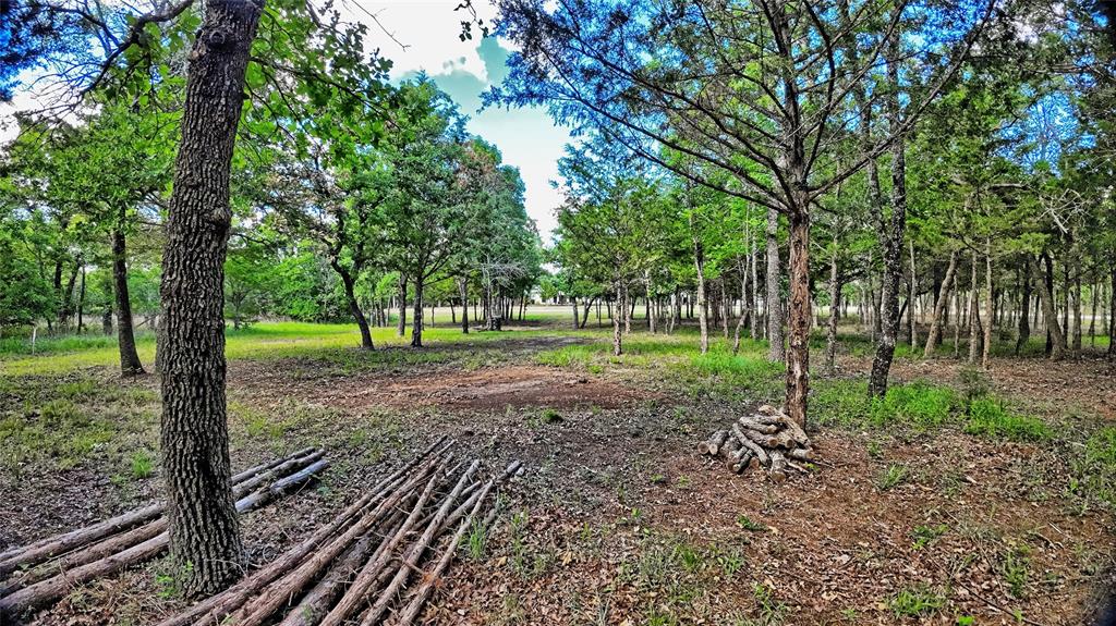 Tucked away at the end of a quiet cul-de-sac and surrounded by mature trees, this 2-acre lot offers a peaceful setting in Silver Lakes Ranch, a private community. The expansive 2,300-acre neighborhood features a mix of wooded and open terrain with scenic views and sits next to Amon G. Carter Lake—perfect for relaxing weekends or full-time living. Community amenities include a pool, clubhouse, gym, and boat-RV storage, plus an RV park with additional conveniences for residents and guests. Residents also have access to two fishing lakes; Lake Horizon includes a boat ramp, and a seasonal creek on the lot feeds into it. You’re just 15 minutes from Bowie for shopping and dining, with easy access to Hwy 287, about 30 minutes to Decatur and roughly 1 hour 20 minutes to DFW Airport. The property was surveyed and stakes remain, so the boundaries are well defined! The owner has painstakingly cleared the brush and made ready a perfect site to build your new home!