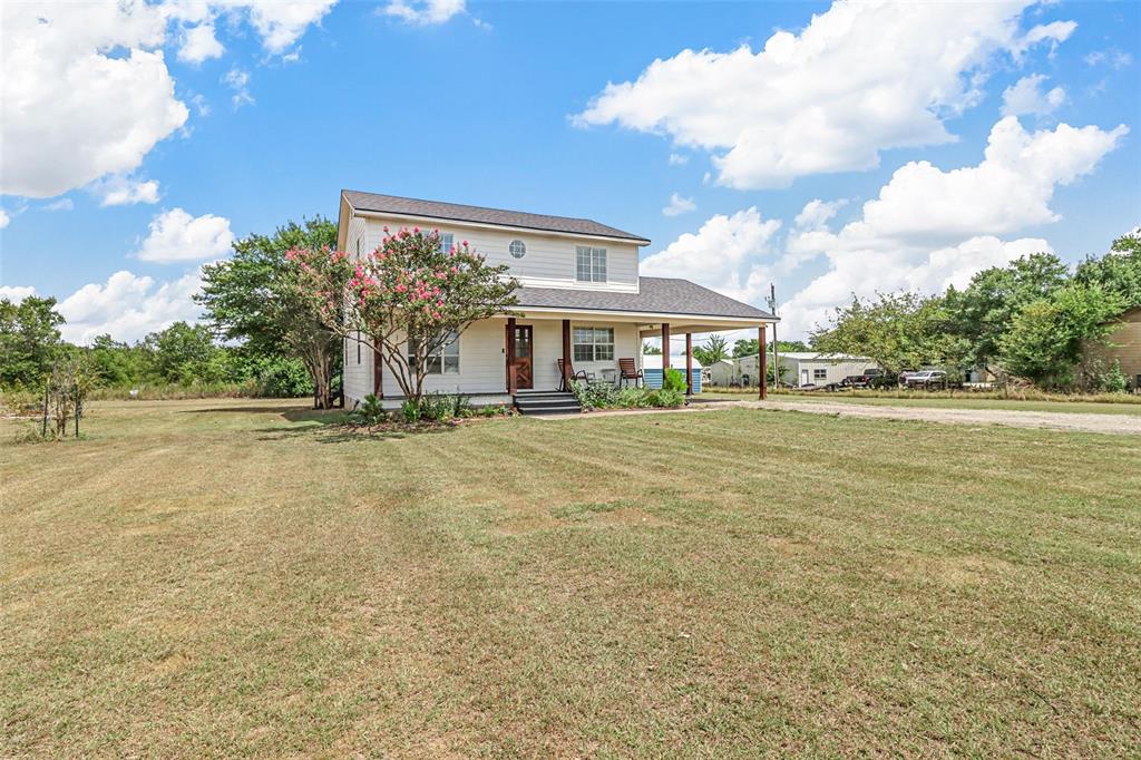 Dreaming of wide-open spaces and peaceful country living? This beautifully updated 3-bedroom, 2.5 bath two story home on 2 acres in Farmersville offers the perfect blend of charm and modern convenience. Start your mornings and end your evenings on the covered front porch, where breathtaking Texas sunsets stretch across the horizon. Step inside to find gorgeous hand-scraped hardwood floors flowing throughout the home, creating warmth and character in every room. Downstairs features two spacious living areas—ideal for a playroom, media space, home library, or entertaining guests. The dining room opens through french doors to a large, shaded back deck overlooking the serene pasture, making indoor-outdoor gatherings effortless. The updated kitchen is complete with rich wood countertops, a dedicated coffee bar, and abundant cabinetry. You’ll appreciate the practical mud bench and freshly painted laundry room designed for everyday convenience. Upstairs, all bedrooms are thoughtfully situated for privacy. The primary suite offers a private bath, walk-in closet, and a cozy office nook—perfect for working from home. Two oversized secondary bedrooms share a well-appointed full bath down the hall. Enjoy the best of both worlds: peaceful country living with modern amenities, including high-speed Spectrum Internet with up to 1 gig download speeds; ideal for streaming, remote work, or gaming. Outside, the fenced back pasture is ready for animals, gardening, or simply enjoying the open space. Two storage buildings provide ample room for tools, hobbies, or equipment. There’s plenty of space to roam, relax, and make this property your own. If you’ve been searching for a move-in-ready country retreat with room to breathe, this is it. Schedule your showing today!