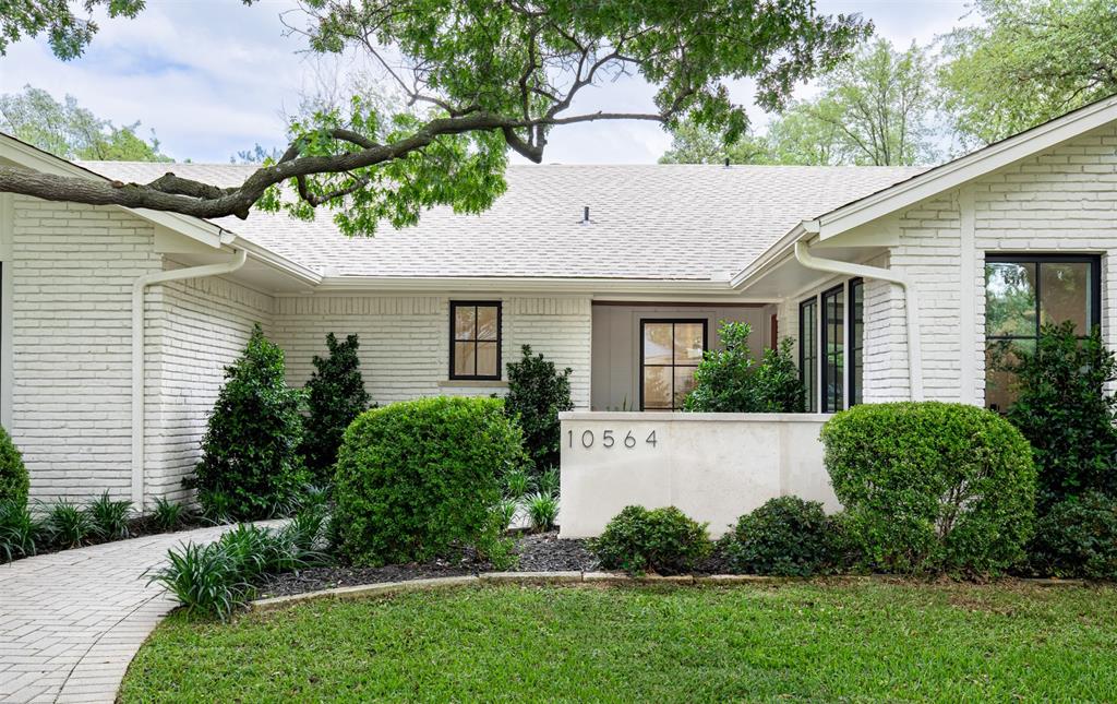 NEW PRICE! Step into this rare Mid-Century ranch tucked in the heart of the Private School Corridor on an expansive one-third acre lot, this exquisitely reimagined home has been redesigned by Par Capital Investments in collaboration with AU Designs. The home was appraised at $1,525,000, and is priced well under value, great opportunity! With over $350,000 in renovations, the façade remains timeless, defined by original chiseled brick and a French Limestone wall, offering a refined first impression with a modern edge. The 4-bedroom, 3.5-bath layout includes a private study and is elevated by 9-foot ceilings, white oak flooring throughout, and gallery-smooth Level 4 wall finishes. This home also includes all custom millwork soft close cabinets throughout. The home includes a reinforced foundation, new plumbing, electrical systems, and premium Sierra Pacific aluminum-clad windows and doors, backed by transferable warranties. All bathroom and kitchen hardware consists of Moen brand & Kholer brand. The kitchen is a true showpiece, featuring a professional-grade six-burner range and premium appliance package. A dramatic marble backsplash extends to the ceiling, complementing Taj Mahal quartz countertops with a sculptural mitered edge and custom white oak shelves. The sink overlooks the backyard, allowing the expansive island to remain uninterrupted—ideal for entertaining. The primary suite offers a spa-like retreat with Calacatta marble mitered edge countertops and two large vanities for his and hers. Outdoors, the backyard presents a private oasis centered around a 10-foot-deep diving pool with a brand-new filtration system. Professional landscaping, three new French drain systems, and a new irrigation system enhance both beauty and functionality. Backing directly to Peter Pan Park, the home enjoys peaceful, tree-lined views and exceptional privacy, complemented by a new 8-foot Japanese cedar fence.