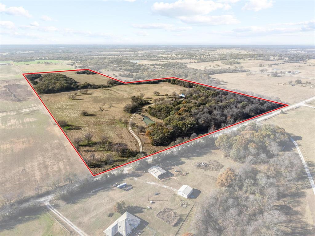 Experience wide-open Texas countryside on this beautiful 65-acre tract, thoughtfully improved and ready for livestock or development. An old barn full of character anchors the property and already has electricity and well water in place. The seller has completely re-fenced the perimeter, added a new cross fence, and constructed sturdy new cattle pens—huge upgrades that save you time and expense. With room to roam, rolling acreage, and essential infrastructure already established, this land is a rare find for ranchers and dreamers alike.