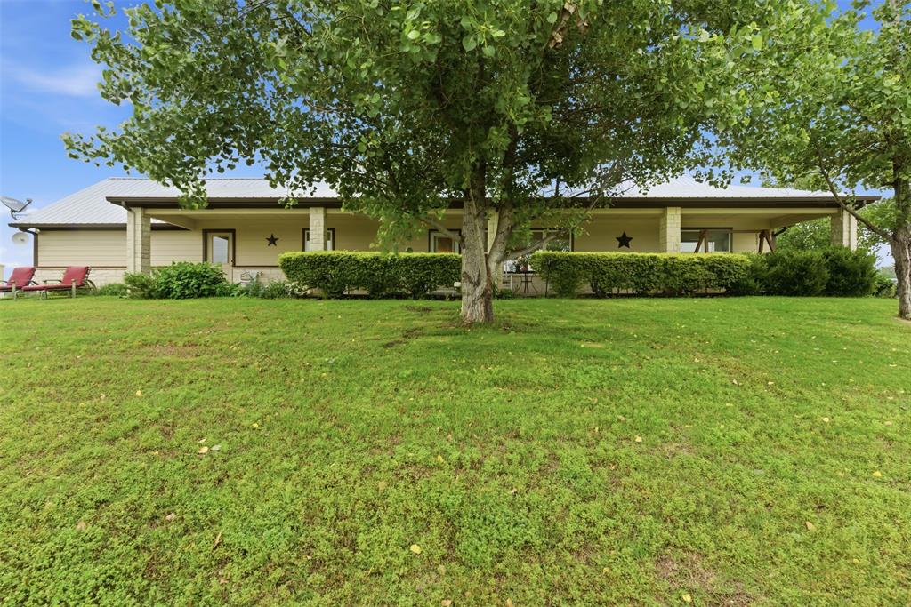 Beautiful 3 bedroom country home, sitting on two AG-EXEMPT tracts totaling 14.924 acres. Enjoy gatherings in the spacious living, kitchen and dining area. Stay warm during the winter months with the stone fireplace with gas logs. Kitchen has large bar area, great cabinet storage, and large pantry. Beautiful wood-look tile throughout home! Primary bedroom has attached bathroom with separate vanities with cabinets, walk-in shower, jetted tub, & a large 12x8 closet with built-ins!  Take in the view from the 8' porch that overlooks the nice landscaping and fenced yard surrounding the home. The  24x30 workshop has electric and county water.  A 10x30 covered slab is attached to the shop. The second tract is .3 acres, leased out to the Nemo Post Office. Located about 10 minutes from Glen Rose, the excellent Glen Rose ISD, dining, shopping, and lots of recreational activities!  It's only about 17 minutes to the Chisholm Trail Parkway in Cleburne, and then another 20 minutes to Fort Worth! Don't need a house but love the land? Approximately 13.34 acres of this land can be purchased separately as shown in MLS# 21295901. (The listing address shown is the Glen Rose 911 physical location, but the mailing address city is Nemo, TX)  ALL MEASUREMENTS ARE APPROXIMATE. ***All offers should use the address 1085 CR 407, NEMO, TX 76070**