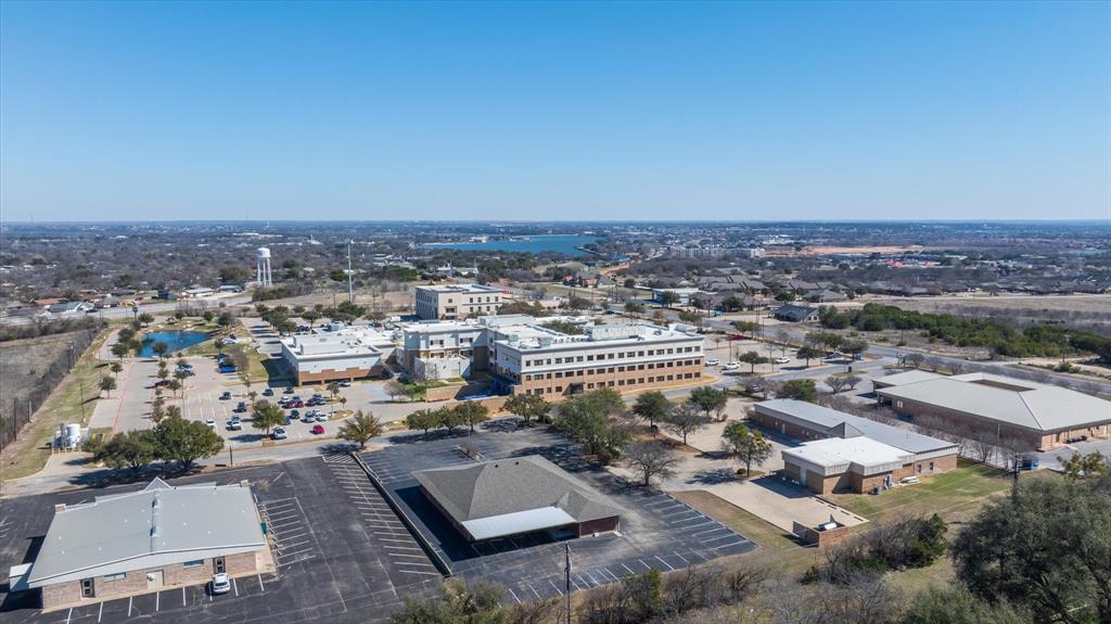 Location, Location, Location!  This established medical building is located across a driveway from the Lake Granbury Hospital!  Current medical practice- tenant is remaining as a tenant.  There is an executed lease with NNN until 2029.  The building is in excellent condition and has been maintained well.  Large parking lot. If you have been looking for a commercial property with a large cap rate, this might be it!  9% cap rate with NNN included!