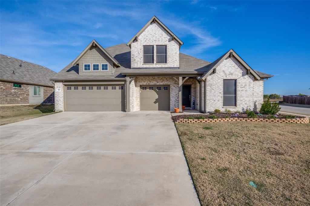 Step into a home that feels welcoming from the moment you arrive. 623 Woodridge Drive offers the space, flow, and thoughtful design that make everyday moments feel easy and meaningful. Set on a prominent corner lot in Oak Point, this newer home combines modern style with warm, livable comfort.  Natural light fills the open living areas, creating a bright and inviting atmosphere where conversations, celebrations, and quiet evenings naturally come together. The kitchen anchors the home as a true gathering place, offering generous workspace, an extra-large pantry and seamless connection to the living and dining areas, perfect for hosting or simply enjoying time at home.  The primary suite provides a peaceful retreat, thoughtfully separated from secondary bedrooms for added privacy. Here, you can unwind at the end of the day in a calming space designed for rest and relaxation. Additional bedrooms and flexible living areas offer room to grow, work from home, or welcome guests with ease.  Outside, the covered patio and spacious backyard invite you to slow down and enjoy the outdoors, whether that means morning coffee, weekend grilling, or creating your own backyard oasis. A three-car garage adds convenience and storage, supporting both daily life and future needs.  Located in Oak Point and served by Little Elm ISD, this home offers a balance of quiet residential living with easy access to nearby lake recreation, parks, shopping, and dining. 623 Woodridge Drive is more than a house, it is a place to settle in, build memories, and truly feel at home.