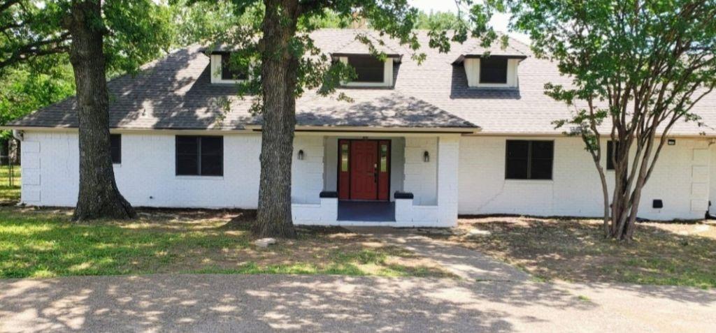 Rare 6 bedroom, 3 bathroom home sits on a sprawling 2.17 acres surrounded by mature trees. This home features a circular driveway a large deck, a covered patio, covered porch, workshop and equipment awning. Spacious, open living offering a generous 2,918 square feet of living space, the interior boasts, an open floor plan designed for effortless living and connection. The kitchen has been updated, has lost of storage, spacious perfect for entertaining. The living room and fireplace create the perfect cozy gathering spot on cool evenings. Discover the ultimate flexibility with this, independent two-bedroom suite. The space features a bright, open-concept living area and a functional kitchenette. With six spacious bedrooms, you have incredible flexibility to grow, hosting overnight guests, or creating dedicated home offices and playrooms. The indoor living space flows seamlessly outside to a spacious backyard setup. A covered patio opens directly onto a stunning wood deck, offering the ultimate setting for summer barbecues, lively gatherings, or simply enjoying a morning coffee while taking in the views of your oversize backyard. Room to Roam and Create With over two acres of land, there is boundless space to explore and play. For hobbyists, DIY enthusiasts, or those just needing extra storage, the property also features a fantastic detached workshop with a convenient equipment awning. The Perfect Location enjoy country-style living with city conveniences just minutes away. This home is ideally located near Ann Brock Elementary School and the shopping and dining along Highway 35. Even better, you are just a short drive from downtown Fort Worth and minutes to Dallas-Fort Worth Airport. This is more than just a house; it is the perfect backdrop for your memories. Schedule your private tour today!