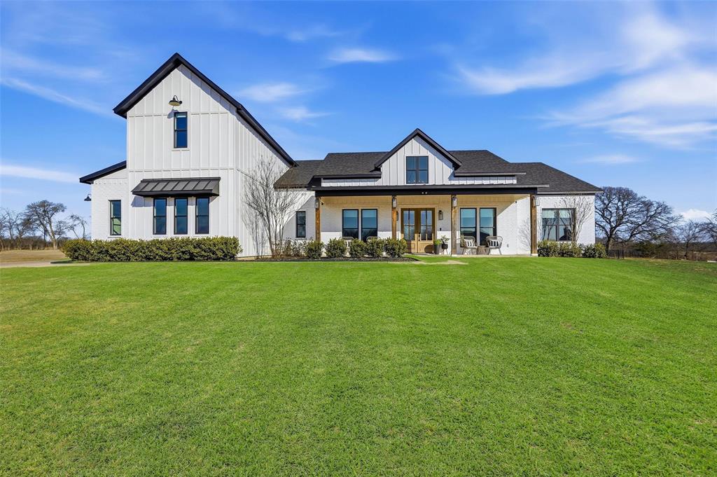 Located in one of North McKinney's premier gated communities, this exceptional 4-bedroom, 4.5-bath luxury estate offers refined living on a private, tree-lined one-acre lot. Combining timeless design with modern comfort, this property delivers the privacy, space, and upscale amenities sought by today's discerning buyers.

The expansive primary suite serves as a private retreat featuring abundant natural light, a spa-inspired ensuite bath with soaking tub, oversized walk-in shower, and an impressive custom closet with extensive built-ins and additional storage. Designed for entertaining, the home includes a sophisticated wine bar with dedicated storage for wine, glassware, and serving essentials.

Expansive sliding glass doors create seamless indoor-outdoor living while filling the home with natural light and showcasing peaceful views of the backyard. The covered patio overlooks mature trees and landscaped grounds, providing a private setting for relaxation or entertaining. A dedicated upstairs fitness room offers flexible space for a home gym, yoga studio, or wellness retreat.

Conveniently located less than 20 minutes from Buc-ee's, H-E-B, shopping, dining, and major thoroughfares, this luxury property offers the perfect balance of privacy and accessibility. A rare opportunity to own an acre estate in one of North McKinney's most desirable gated communities.

Buyer may receive a FREE 1-0 Rate Buydown when using Seller's preferred lender.