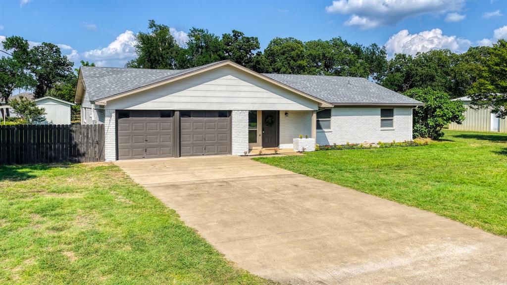 This is the one you have been waiting for!! Welcome to this Granbury masterpiece, that offers two lots. One lot with your new home on it and one with a spacious shop and driveway. This property has it all, 3 bedrooms, 2 bathrooms, 2 Car Garage and sitting on over a half acre. Step into your spectacular home and enjoy an open floor plan, with plenty of upgrades throughout the home that you are sure to fall in love. Upgrades include, New HVAC, Fresh Paint Throughout, New Luxury Vinyl Plank in living areas and Hallways, New Carpet in all bedrooms, New Hardware Throughout, Gorgeous New Counter tops throughout and much more. Step out back and enjoy a perfect place for your children and furry friends to play. On your additional lot, your fully insulated shop will be a perfect place to tinker, or store those jet skies you have been wanting to buy. Perfectly located, you will be down the street from the 144 hwy that is a short drive to Stumpy's Lakeside Grill, and Lake Granbury's Marina. To top it all off, your family will have quick access to fun activities at City Park, Granbury Skating Rink, The Brazos Drive In and More. This property is one of a kind and is sure to impress the whole family. This one will not last long, contact your favorite agent and schedule your private showing today!!