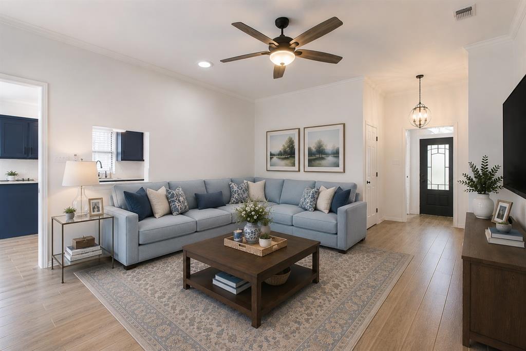 Beautifully updated home located directly across from the neighborhood greenbelt and walking trail, offering peaceful views, mature trees, and convenient access to shopping. The kitchen features quartz countertops, new appliances, and an opening to the main living area. Both bathrooms have been updated, including a primary bath with granite countertops, updated fixtures, and a refreshed tub and shower.

The entry showcases a striking brick wall detail that carries into the main living area. A light-filled sunroom offers a second living space with an open feel while maintaining separation—perfect for relaxing or entertaining.

Additional improvements include updated lighting and ceiling fans throughout, fresh paint in the kitchen and living areas and wood-look tile flooring. Major updates include new window treatments (under warranty), new garage door and opener (2024), updated front and storm doors, and front yard resodded with St. Augustine grass (2024).
