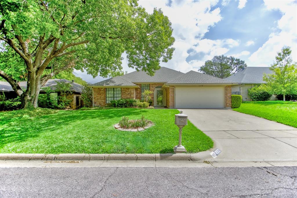 Beautifully updated home located directly across from the neighborhood greenbelt and walking trail, offering peaceful views, mature trees, and convenient access to shopping. The kitchen features quartz countertops, new appliances, and an opening to the main living area. Both bathrooms have been updated, including a primary bath with granite countertops, updated fixtures, and a refreshed tub and shower.

The entry showcases a striking brick wall detail that carries into the main living area. A light-filled sunroom offers a second living space with an open feel while maintaining separation—perfect for relaxing or entertaining.

Additional improvements include updated lighting and ceiling fans throughout, fresh paint in the kitchen and living areas and wood-look tile flooring. Major updates include new window treatments (under warranty), new garage door and opener (2024), updated front and storm doors, and front yard resodded with St. Augustine grass (2024).