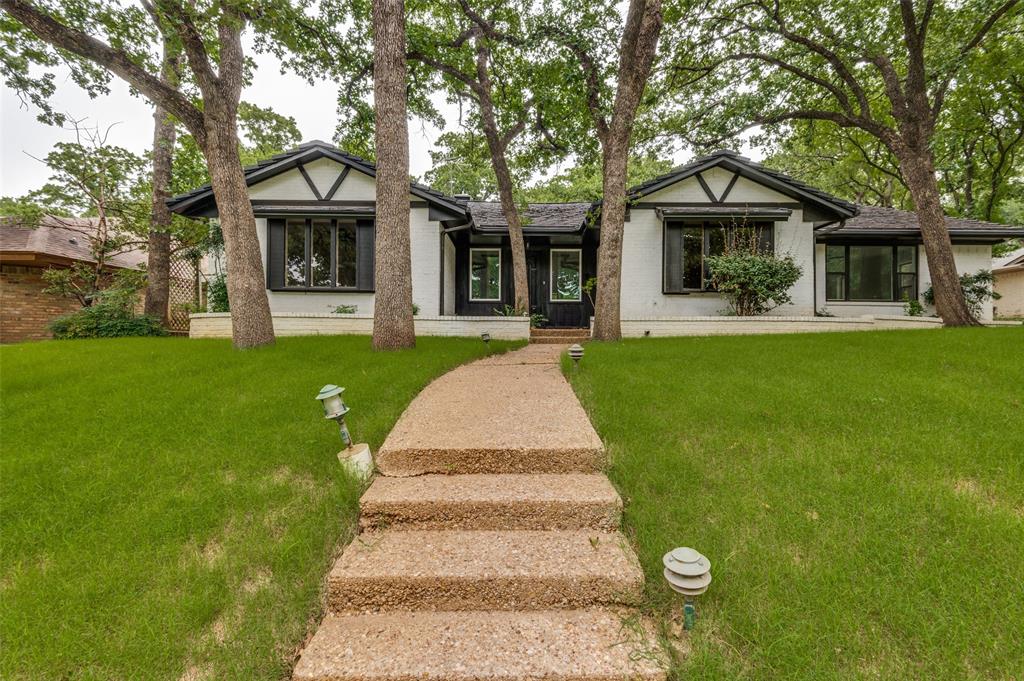 5 BEDROOMS and 4 FULL BATHS...3 of the bedrooms are ensuite, and the other have a jack and jill arrangement. Meaning ALL bedrooms have direct access to a full bath. This lovely remodeled home is walking distance to the Jones Academy of Fine Arts and Dual Language. Easy access to I 30 makes commuting to Dallas or Ft Worth ideal. Close enough to the entertainment district without being too close for comfort. You will love the rolling hills and gorgeous oak lined streets of this established subdivision. The interior is bathed in nice neutral tones and luxury vinyl plank flooring. All appliances are new. Absolutely MOVE IN READY. Upgraded metal roof is a great feature. It is not only beautiful but also very high performing. Gutters and auto sprinklers all around and an oversized garage are just a few of the exterior amenities you'll enjoy. IDEAL FOR MULTI GENERATIONAL NEEDS too.
