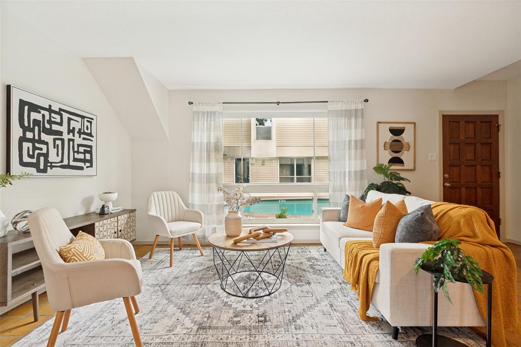 This updated condo feels warm and comfortable the minute you walk in, with abundant natural light and upgraded windows throughout. The kitchen features granite countertops and custom cabinet pull-outs, opening to the dining area. French doors lead to a private, fenced patio that extends the living space outdoors.
Upstairs, the oversized primary bedroom includes a wood-burning fireplace and a spacious walk-in closet. The secondary bedroom also has a walk-in closet and works well as a guest room, office, or flex space. The updated bathroom features a walk-in shower and clean, classic finishes. A full-size washer and dryer are included in the unit.
The sparkling community pool is just steps from the front door, and the community itself is gated, quiet, and beautifully maintained. This Oak Lawn location is hard to beat, within walking distance of Cedar Springs and just minutes from Uptown and the Medical District, with plenty of dining, shopping, and nightlife nearby.