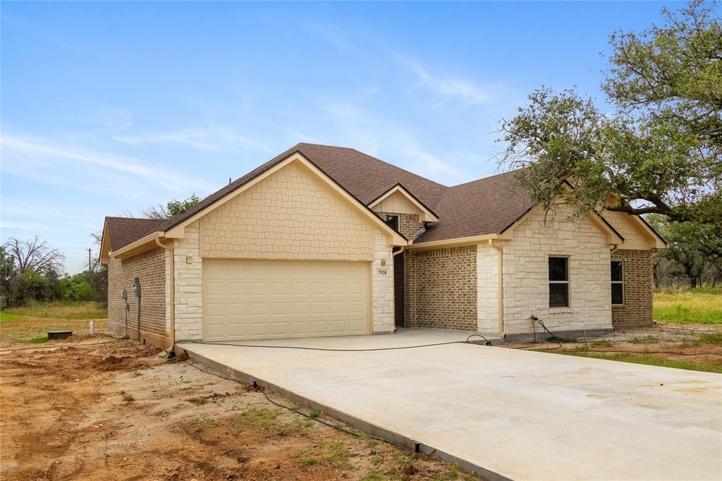 Welcome to your dream home located in the prestigious Hideout Golf Club & Resort. This exquisite 1,887 square foot, new construction residence perfectly blends modern luxury with serene golf course living. With 4 bedrooms & 2 beautiful bathrooms, this home is designed for comfort & elegance. Step into an open-concept living space featuring high ceilings, and luxurious finishes throughout. The kitchen boasts beautiful new appliances, granite countertops, a large island, & custom cabinetry. The primary bedroom offers a peaceful retreat with a walk-in closet & a luxurious ensuite bathroom featuring dual vanities, a tub, & a separate walk-in shower. Three additional bedrooms provide plenty of space for family, guests, or a home office. Each room is designed with comfort and style in mind. Nestled in the heart of the Hideout Golf Club and Resort, residents have access to world-class amenities including an 18-hole championship golf course, resort-style pool, fitness center, & dining options.
