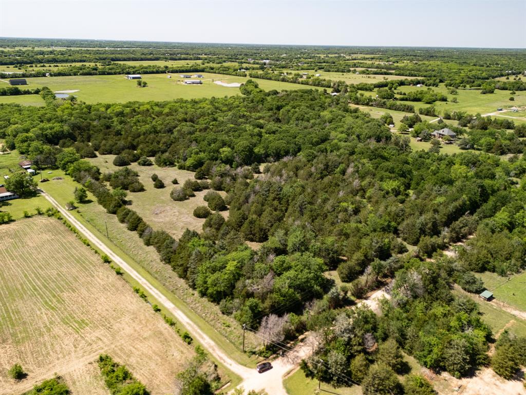 13 unrestricted acres in Lone Oak, Texas with mature trees, open clearings, and multiple potential homesites in Hopkins County. This East Texas property offers a private rural setting with county road frontage, electric available at the road, and the flexibility to build a custom home, barndominium, cabin, or weekend retreat without deed restrictions. The land features a natural blend of wooded coverage and usable open space, creating both privacy and functionality for residential or recreational use. Well and septic will be needed.

Positioned within reach of Greenville, Sulphur Springs, and Lake Tawakoni, the property combines peaceful country living with convenient access to shopping, dining, and outdoor recreation. Lake Tawakoni, one of the largest reservoirs in East Texas at nearly 38,000 acres, is known for boating, fishing, camping, and public park access, including nearby Wind Point Park and Lake Tawakoni State Park. Greenville is approximately 20 miles away for retail, restaurants, and daily conveniences, while Sulphur Springs offers additional dining, medical services, and entertainment options in the heart of Hopkins County. Dallas is also within driving distance for buyers seeking rural land with access to the Metroplex.

Buyers searching for unrestricted land in East Texas, wooded acreage near Dallas, or build-ready property near Lake Tawakoni will appreciate the location, flexibility, and natural character this property provides. Contact listing agent for more information or to schedule a private tour of the land