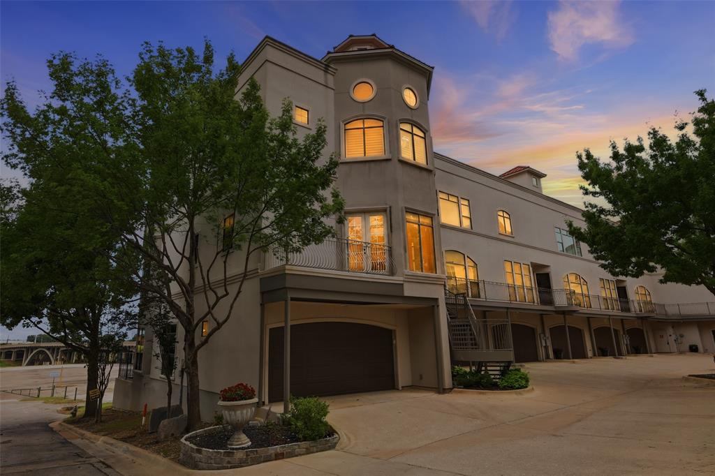 Experience elevated urban living in this luxurious three-story condo ideally located near the Trinity River Trails, Panther Island, and everything downtown Fort Worth has to offer. Thoughtfully designed with high-end finishes and sophisticated architectural details throughout, this exceptional residence combines modern luxury with effortless lock-and-leave convenience.
The main living area is filled with natural light and features high ceilings and Venetian plaster walls, rich finishes, expansive entertaining spaces, and seamless flow into the chef’s kitchen and dining area. Designed to impress, the kitchen offers premium appliances, abundant cabinetry, generous prep space, and exceptional functionality for both everyday living and entertaining.
The third floor primary suite offers a true luxury experience with a sitting area, fireplace, spa-inspired bath, and custom details throughout. An oversized private office provides the perfect work-from-home setup and could easily function as additional owners retreat living space. Additional bedrooms and living spaces are thoughtfully separated for privacy and flexibility.
Take the private elevator to the rooftop patio where breathtaking views of the Fort Worth skyline, Trinity River Trails, and Panther Island create the perfect backdrop for entertaining or relaxing. Additional features include an oversized garage, multiple living areas, upscale fixtures and finishes, and a premier location just minutes from dining, entertainment, museums, shopping, and major highways.
This one-of-a-kind luxury residence offers sophisticated city living with exceptional style, comfort, and convenience in the heart of Fort Worth.