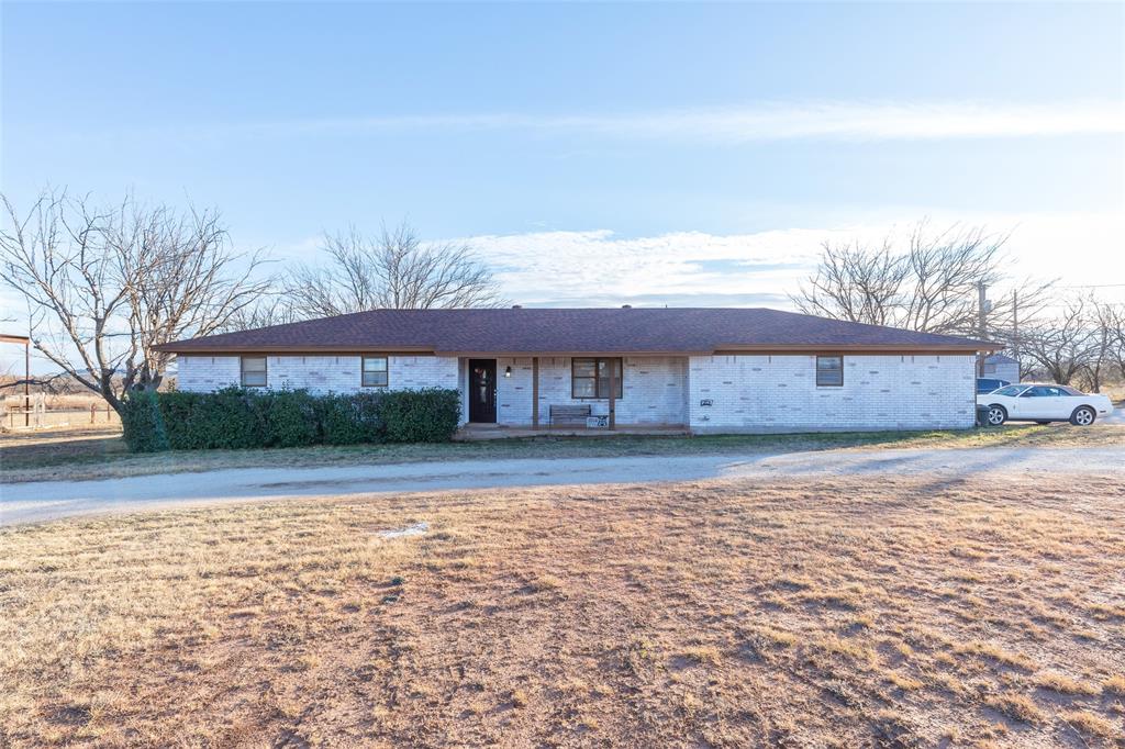 Spacious 4-Bedroom Haven with Pool on 5 acres. Discover the perfect blend of comfort and style in this splendid 4-bedroom, 2-bathroom residence located in Abilene. Boasting a practical yet elegant design, this home provides ideal spaces for relaxation and entertainment, coupled with modern amenities to cater to today's busy lifestyle. The living area offers a cozy retreat with a fireplace that adds warmth and charm to the home. This well-maintained property extends a warm invitation to its generously sized, large kitchen, a culinary haven with ample counter space ideal for cooking enthusiasts or casual family meals. The seamless flow from the kitchen to the dining area makes entertaining a breeze. The covered back patio enables entertaining indoors or outdoors. Sit on the back porch and take in the back acreage while keeping an eye on the pool.  The primary suite features an en-suite bathroom, offering a tranquil retreat at the end of the day. Three additional bedrooms provide flexibility for guests, home office, or hobbies, each designed for comfort and personalized living. A large circular drive adds functionality to ensure ample parking for guests. The two-car garage provides not only secure parking but also additional storage space for tools and recreational gear. There is a cedar closet in the garage for elevated storage use. This property, with its thoughtful layout and welcoming design, promises a lifestyle that effortlessly combines ease and elegance. Located on the southern city limits in the Wylie area of Abilene, this home offers access to city amenities, schools, and little bit of country life. Cross fenced with additional covered parking and space for a shop.  Don’t miss the opportunity to own this exquisite residence.