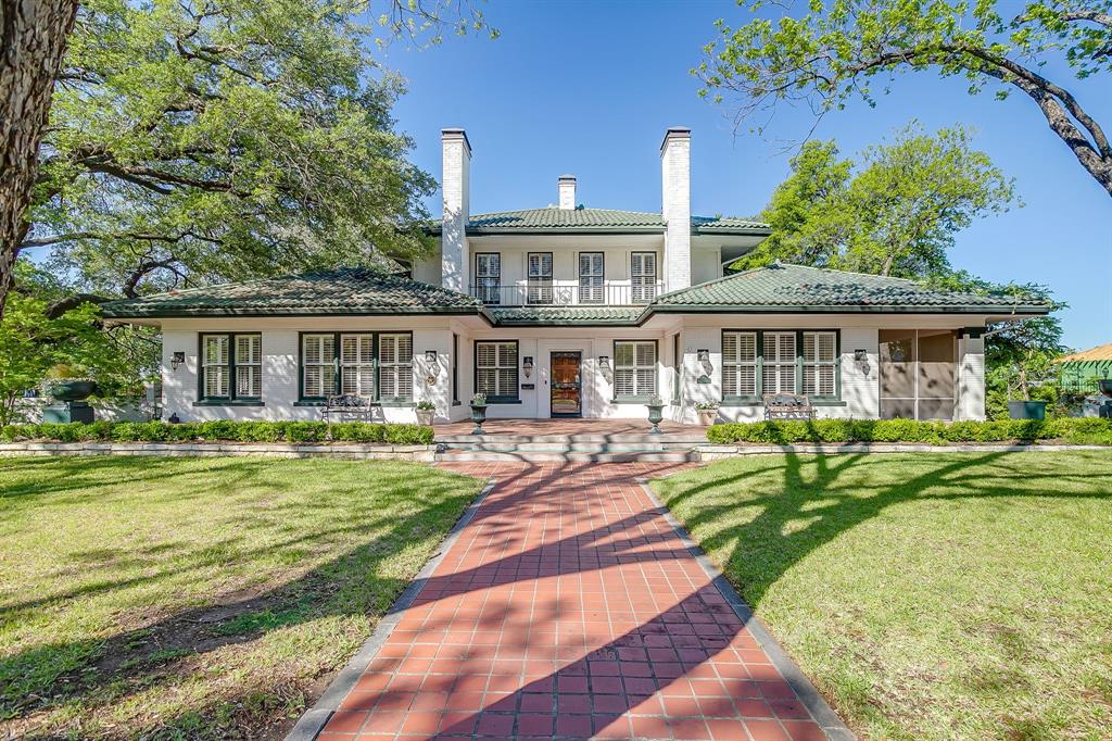 An offering of this historical significance and architectural elegance rarely comes to market, especially when paired with one of the best locations in Fort Worth. Set on 1.3 acres on a premier street in Mistletoe Heights, this 1919 Prairie and Craftsman-style residence—often referred to as the Waggoner House for its original owner, Anne Waggoner—sits on the bluff overlooking the Trinity River, just six minutes from downtown and a short walk to the Trinity Trails and Westbend.

The property includes 4,599 square feet in the main house, a two-car garage, and a heated pool and spa, along with a large, functional basement with full bath (not included in square footage), and two one-bedroom, one-bath cottages.

The main house retains its original character with hardwood floors, four working fireplaces, crown molding, and French doors, while having been steadily improved for modern living. All bathrooms in the main living area have been reworked and expanded, including all main floor bathrooms with heated floors! 

A rare opportunity to steward a piece of Texas history and carry forward a legacy of ownership.