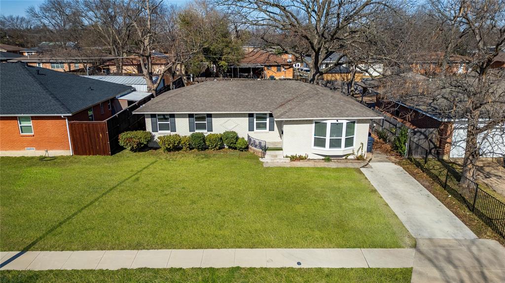 Welcome home to this charming brick residence that perfectly blends comfort with contemporary updates in this delightful and established neighborhood. This 3-bedroom, 2-full bath home offers over 1,500 square feet of thoughtfully designed living space, offering the ideal canvas for your next chapter.

Step inside and immediately appreciate the open concept layout that seamlessly connects the living, kitchen & dining rooms, creating an inviting atmosphere perfect for both everyday living and entertaining guests. The updated kitchen features an island that serves double duty as your culinary command center and a casual gathering spot for morning coffee or evening conversations.

Modern updates abound throughout this move-in-ready gem. Fresh paint adorns the walls, new flooring flows underfoot, and replacement windows flood the interior with natural light while keeping energy costs in check. The bathrooms have received thoughtful renovations, including a refreshing walk-in shower that transforms your daily routine into a spa-like experience.

This home offers the perfect blend of updated amenities and welcoming charm.

Location enhances the appeal even further. Students have convenient access to W. W. Samuell High School just moments away, while J. P. Hawn Park provides nearby green space for weekend recreation. Public transportation options, including the Buckner Station, make commuting a breeze.

This opportunity won't last long. Schedule your tour today and discover why this beautifully updated home deserves to be your next address.