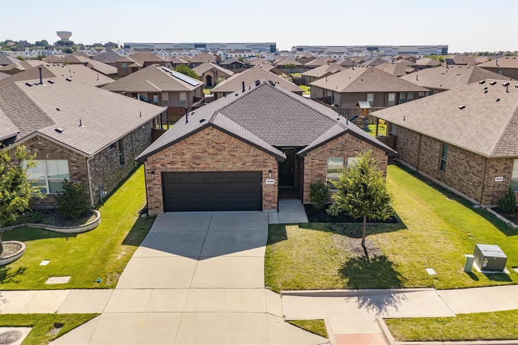 Nestled in the desirable Hawthorne Meadows neighborhood and zoned for the award-winning Northwest ISD, this beautifully upgraded 3-bedroom, 2-bath home offers the perfect blend of style, comfort, and functionality.

Step inside through a stunning custom Italian tile entry into an inviting open-concept floor plan featuring engineered hardwood flooring, elegant crown molding, custom window trim, and abundant natural light. Designer touches, including updated lighting, custom window shades, and striking black interior doors, add warmth and character throughout the home. The spacious living room flows seamlessly into the kitchen and dining area, creating an ideal space for entertaining or everyday living.

The well-appointed kitchen boasts granite countertops, stainless steel appliances, ample cabinetry, generous prep space, and a large island overlooking the living area. The private primary suite offers a peaceful retreat with an ensuite bath featuring an extended dual-sink vanity, soaking tub, separate shower, and a spacious walk-in closet. Two additional bedrooms provide flexibility for guests, a home office, or hobbies, while the beautifully updated secondary bath features a sleek frameless glass shower door.

Outside, enjoy a spacious backyard with a covered patio that's perfect for morning coffee, weekend barbecues, or relaxing evenings outdoors. The epoxy-coated garage floor and added storage shelving provide both durability and everyday convenience.

Conveniently located just minutes from shopping, dining, and entertainment, with easy access to I-35W and Highway 287, this home offers an easy commute to Alliance Town Center, Downtown Fort Worth, the Fort Worth Stockyards, and DFW International Airport.

Beautifully upgraded, meticulously maintained, and truly move-in ready, this exceptional home is ready to welcome its next owners. Schedule your private showing today!