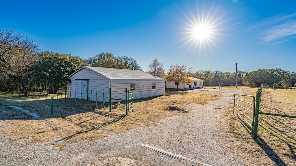 Tucked away on 3.665 acres, this secluded country property offers the ideal setting for a private ranchette lifestyle. The home features an open floor plan with split bedrooms and a cozy wood-burning stove anchoring the living area. Outdoors, there’s plenty of room to roam, garden, or keep animals, while the 30x30 metal garage provides ample space for equipment, tools, or hobbies. A private well adds to the self-sufficient appeal. With wide-open space and peaceful surroundings, this property offers endless potential to create your own country retreat!