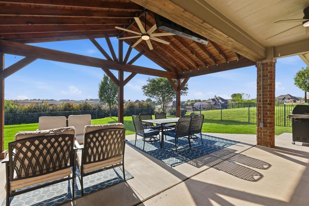 HILLTOP VIEWS!  Huge covered patio with beautiful views.  If you're tired of cookie cutter lots this OVER A QUARTER ACRE YARD is the one for you.  The stars at night are amazing.  In addition to the patio the covered front porch is just as nice!  For those that like relaxing outside in the shade this is the perfect home.  Inside features plank tile floors throughout much of the home.  Big open kitchen.  4 bedrooms PLUS an office.  The HOA also includes access to a community pool.  This is an upscale neighborhood with considerably more expensive homes throughout.  Eagle Mountain Park is a short drive away and features some of the best hiking and LAKE VIEWS in North Texas.