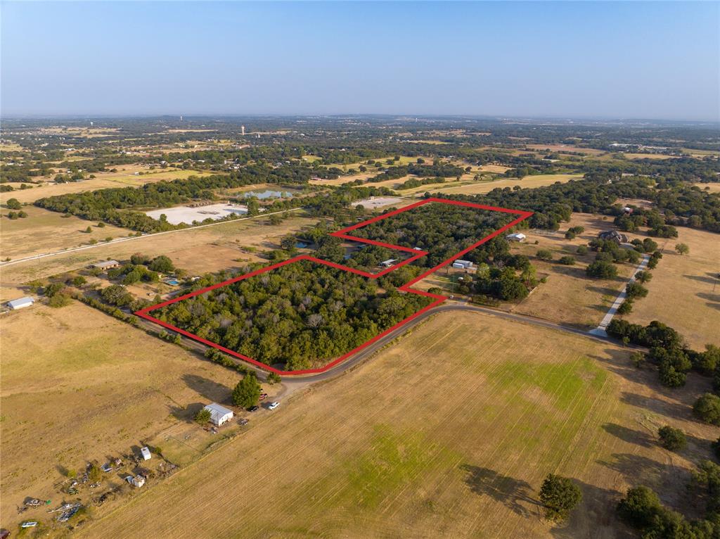 Come and build your amazing home on this 20+ acre property in Joshua TX. Enjoy country living with lots of trees with the convenience of Restaurants, Super Markets Golf courses and all the amenities you may want. Burleson less than eight miles away to the North. This gorgeous property is conveniently located midway between I 35 and the Chisolm Trail Parkway, giving it multiple options, with convenient access back to Ft Worth.