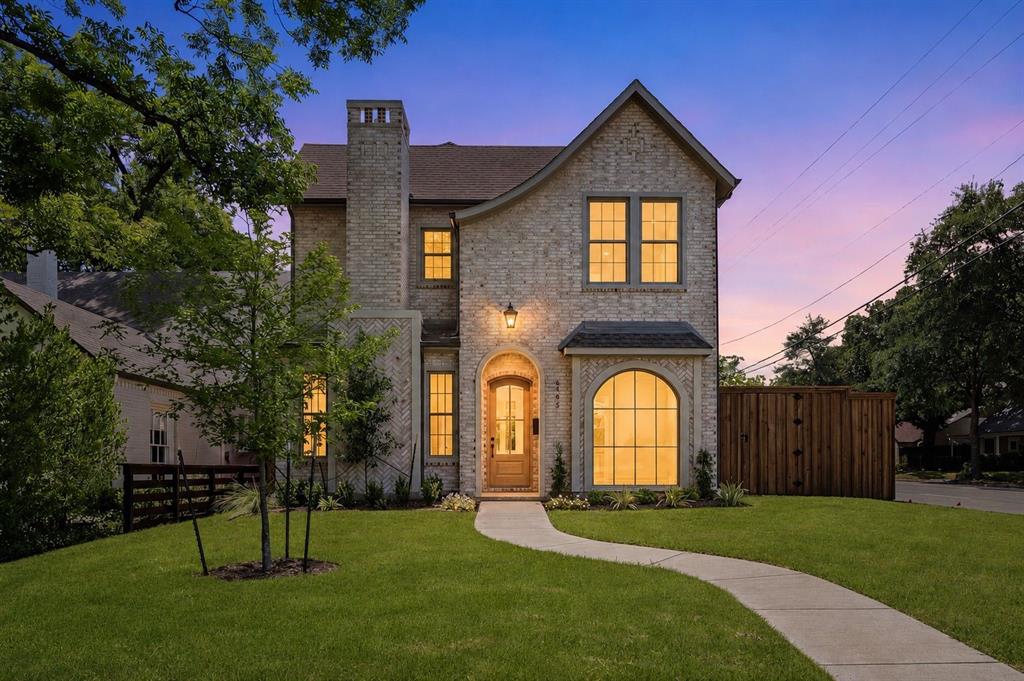 From the moment you arrive, the striking architecture of this Transitional Modern residence with Tudor inspired elements creates an unforgettable first impression. Inside, soaring ceilings, warm wood floors, and expansive windows fill the home with natural light, creating an inviting and elegant atmosphere.

The heart of the home seamlessly connects the kitchen, living, and dining spaces, designed for both everyday living and entertaining. The oversized island naturally becomes a gathering place, while the chef’s kitchen features panel ready appliances, a 48 inch range, designer finishes, and custom details throughout.

Whether hosting by the fire or enjoying a quiet evening at home, the space feels both grand and comfortable. A private study offers the perfect work from home retreat, while the nearby wet bar makes entertaining effortless.

The primary suite is a peaceful escape with a spa inspired bath featuring calming textures and luxurious finishes. Every detail of this custom 2026 residence was thoughtfully designed to create a home that feels sophisticated, welcoming, and truly exceptional.