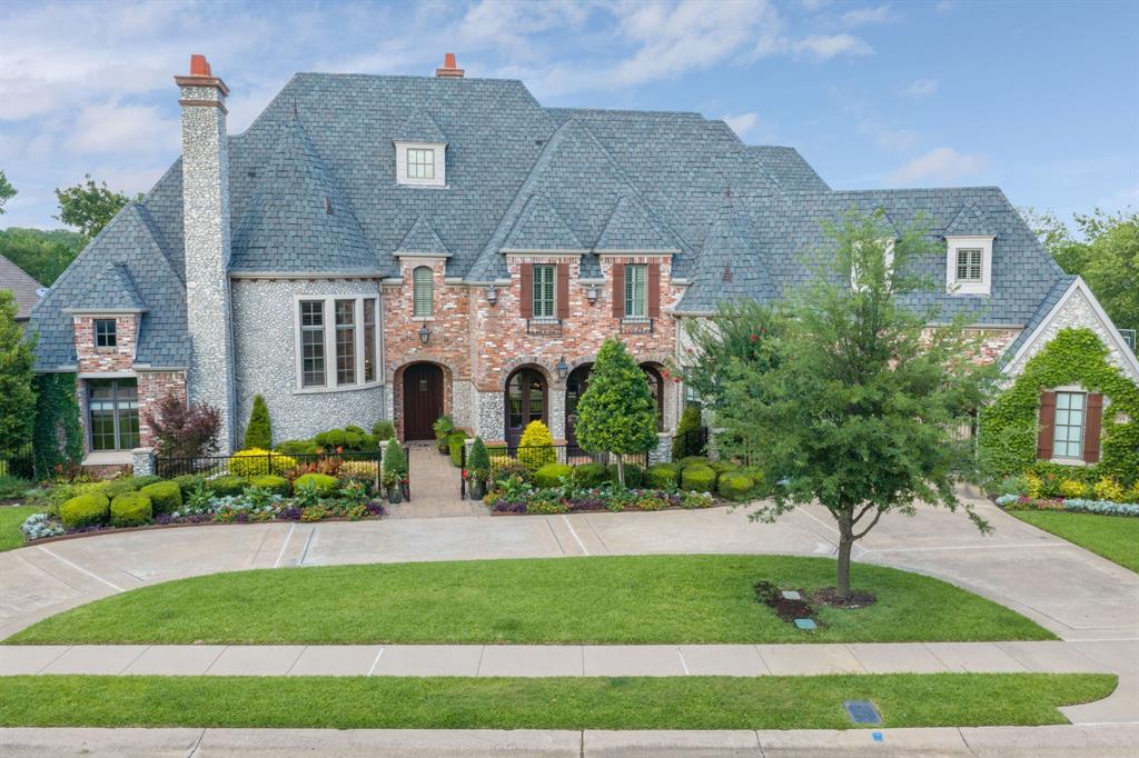 Exceptional French Country Estate offers timeless architecture, luxury finishes, and is in award-winning Carroll ISD schools in the gated Timarron Chadwick Crossing community. Welcome guests thru the triple-arched entry, carved detailing and iron chandeliers, sets the tone for the craftsmanship found throughout the home. Rich herringbone hardwood floors in the formal dining room and custom built-in hutch and adjoining butler’s pantry with wet bar, wine fridge & storage, make entertaining effortless. At the heart of the home, the stunning family room features soaring ceilings, custom arched beam details, Juliet balconies, and a striking floor-to-ceiling fireplace, all enhanced by abundant natural light. Designed for both beauty and function, the gourmet kitchen showcases updated quartzite countertops, an Italian mosaic tile backsplash over the Viking six burner gas cooktop and double oven, dual farmhouse sinks, a peninsula island and painted and natural wood cabinetry, GE Sub-Zero refrigeration, and generous prep space. Private executive office with fireplace, built-in cabinetry, and dedicated computer closet. The luxurious primary retreat serves as a peaceful escape with a custom fireplace and spa-inspired bath featuring separate vanities, closets and double shower, freestanding soaking tub, beverage space and great storage. Upstairs, a spacious game room with wet bar and outdoor covered balcony, a dedicated media room and private guest suites, baths and generous closets, great for family and overnight guests. Impressive outdoor living oasis showcases a sparkling pool, spa, covered patio, cooking area and panoramic views of the landscaped grounds. Timarron amenities include community pools, clubhouses, tennis courts, playgrounds & scenic walking trails. Minutes from Southlake Town Square, shops, dining & Southlake Library. More than a luxury home, this is a place where family traditions are celebrated, friends gather, and lasting memories are made for years to come!