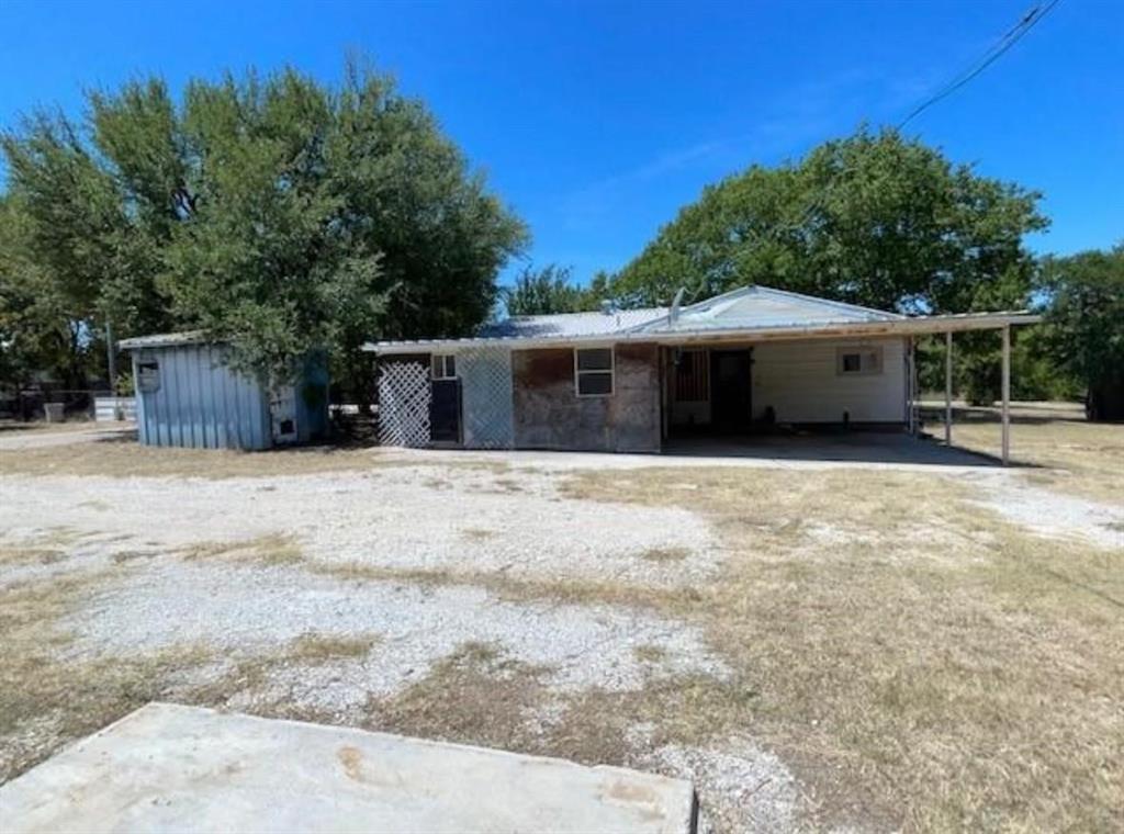 CALLING ALL CAR ENTHUSIAST or MACHINIST!!! This property Offers a Man's dream garage and workshop with lake views. You are only one lot from the lake, and the property consist of multiple lots. Seller has additional surrounding lots available from $1000-$2300. This property also offers a small cabin like structure with electric ran to it. Great lot, with a lot of potential. Bring all the cars or toys you can handle and keep them under covered parking or put them in a garage- you have plenty of space for all of it. The main house is in some need of minor updating and repairs, and the cabin would need a new ceiling, and floors. Overall great property with tons of potential for a lake cabin or a rental. COME AND CHECK IT OUT. Square footage of main house is an estimate and has not been confirmed.