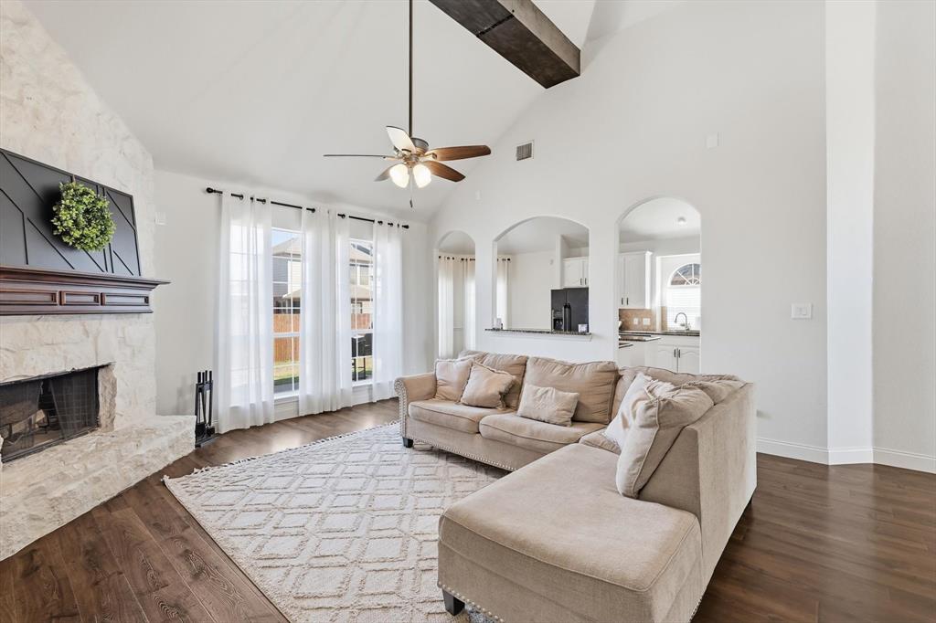 Step into this stunning two-story home located on a quiet cul-de-sac, offering 5 bedrooms and an impressive open-concept design. The main living room showcases soaring ceilings, a gorgeous stone fireplace & abundance of natural light creating an inviting airy atmosphere anchored by rich hardwood floors throughout. A Spacious kitchen features granite countertops, a large center island, eating bar & a separate coffee or wine bar area, ample cabinetry with a seamless flow into the living and dining areas ideal for entertaining. A flexible downstairs front room is perfect for a home office or formal living space.  Master bedroom & additional bedroom located on the 1st floor with 3 additional bedrooms & game room located on the 2nd.  Recent upgrades thoughtfully completed throughout, neutral tones, abundant natural light, up-to-date finishes, make this home warm, timeless, and move-in ready. Ideal for gatherings, relaxing nights in, or showcasing your personal style this home offers both beauty and functionality in every detail.