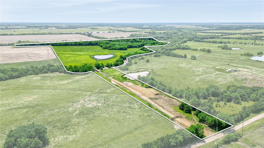 Owner Financing available! This property has a water meter, new driveway and newly built pond, new entrance, bridge, & fence install as well. 55 beautiful acres adjacent to Army Corp of Engineers land on the new Lake Ralph Hall project in Honey Grove, TX! This property features open pasture with a gorgeous limestone creek flowing through the back of the property. A majority of this property is open pasture, and the eastern portion has mature trees along the creek. This property is ideal for building your dream home, recreational use, the perfect long term AG exempt investment, or all of the above!