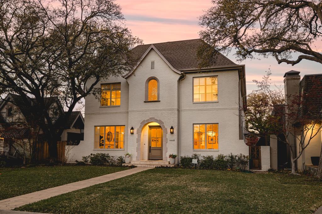 Presenting 4448 Mockingbird, a classic and unique Greenwell Homes residence that marries timeless architecture with thoughtful modern living. Set on pier-and-beam construction, the painted-brick façade with arched entry and leaded-glass window opens to an efficient, gracious floor plan finished with extensive hardwoods, marble surfaces, and designer lighting. Formal dining is anchored by sparkling pendants and tall windows, while a refined living room centers on a fireplace and gallery wall. A private study with built-ins offers ideal work-from-home space. The open family room flows to the gourmet kitchen, where inset cabinetry with glass-front uppers, marble countertops, a butcher-block island with prep sink, 6-burner gas cooktop, double ovens, built-in refrigerator, and a generous butler’s pantry or walk-through service area provide exceptional function and storage. Bathrooms feature custom-designed vanities, marble tops, and hand-painted tile details; the serene primary suite adds a spa-style bath with separate vanities and soaking tub, plus an enviable custom closet lined with shelving and drawers. Upstairs, a vaulted game or media room accommodates theater seating, music, and gaming zones. Outdoor living shines under a covered loggia with arched openings, fireplace, ceiling speakers and lighting, and adjacent grill, all overlooking a private, low-maintenance turfed yard within a board-on-board fence. A rear-entry two-car garage and wide drive complete the setting. With eye stopping attention to detail throughout, this Greenwell Homes property delivers craftsmanship, comfort, and style on one of Mockingbird’s most desirable addresses.
